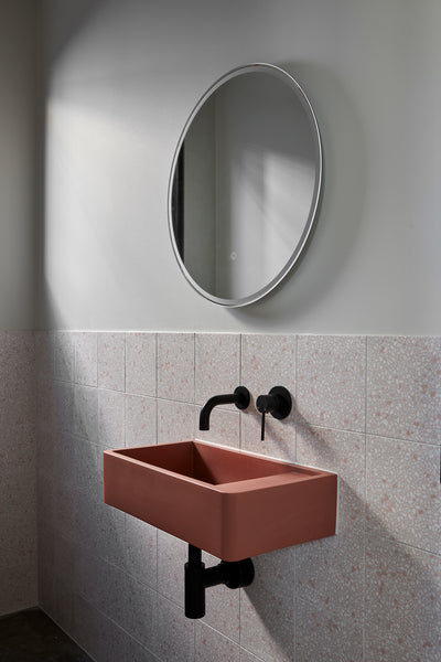 Powder room with Nood Co. Shelf 02 in Musk and terrazzo-look tiles, by Urban Form and Samuel Architecture.